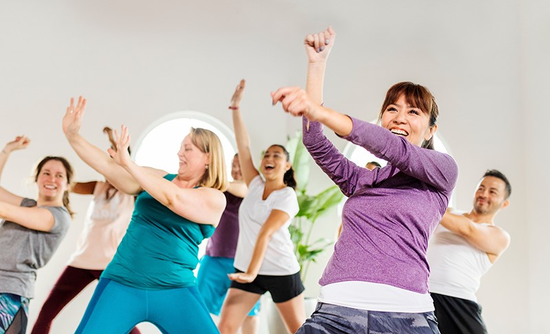 People in a total body cardio fitness class