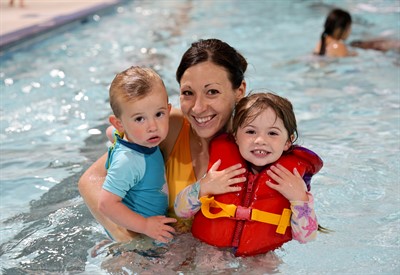 Family swimming together